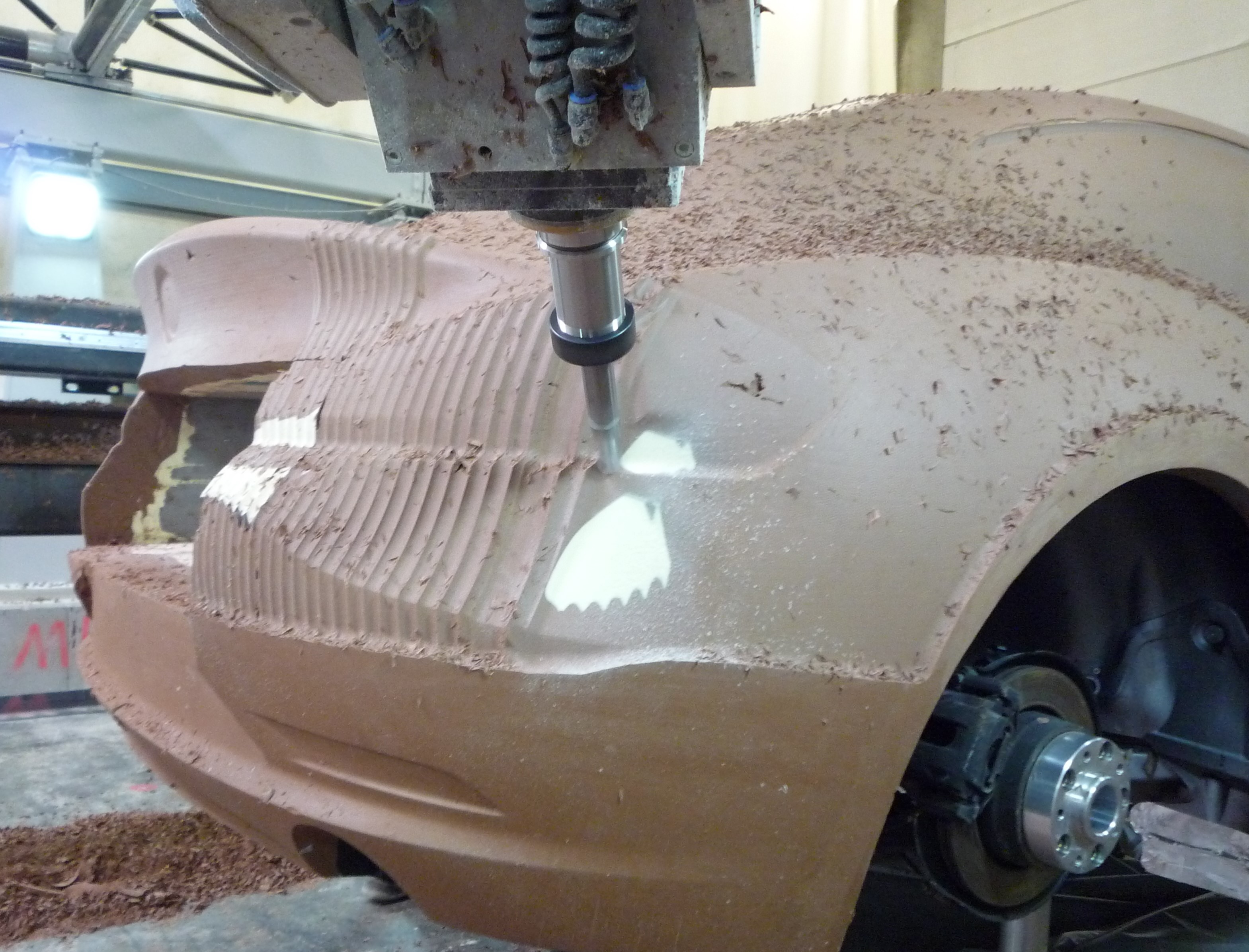 Person inspecting the massive milling center for a mega yacht